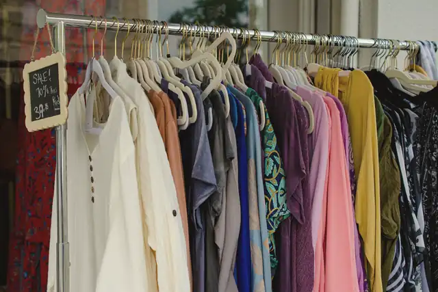 Secondhand clothing hanging on a rail